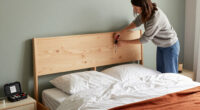 Instead Of Tossing Her Bed Frame, She Put A $40 DIY Headboard In Front
